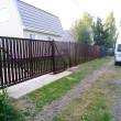 Откатные ворота из  с горизонтальным штакетником автоматические на ж/б